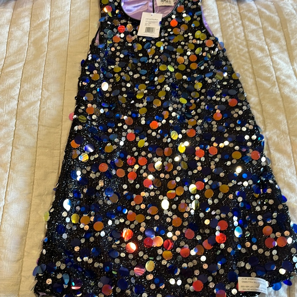 Brand new black dress with embellishments.